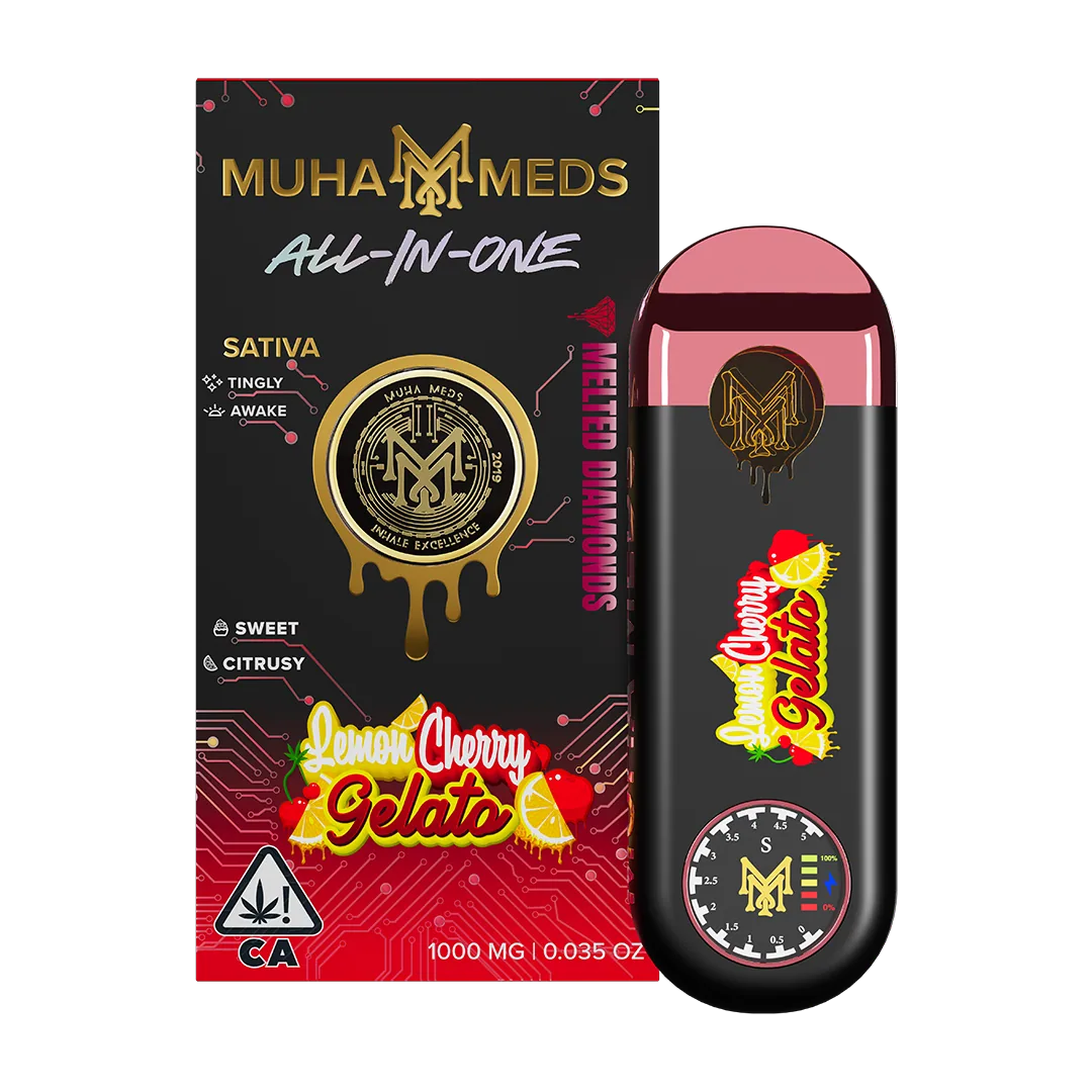 A Muha Meds device photographed on a dark surface beside its packaging.